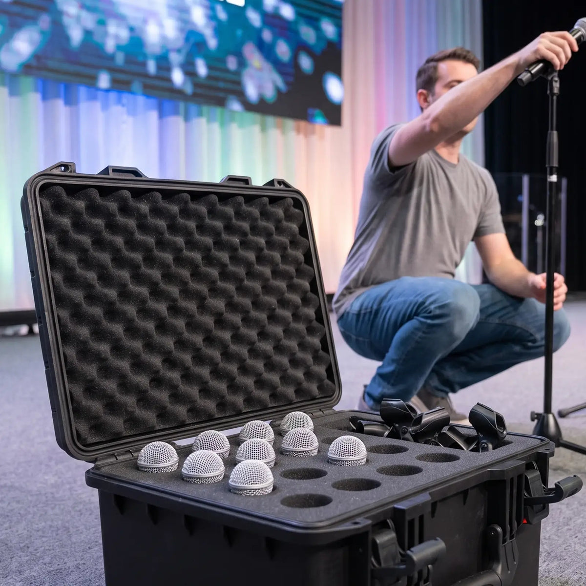 16 Slot Microphone Hard Case with mics and lips neatly placed inside it.